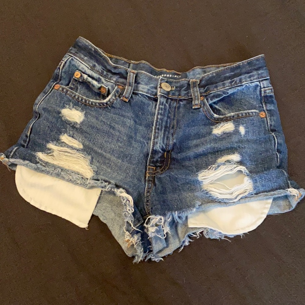 Blue ripped jean shorts.